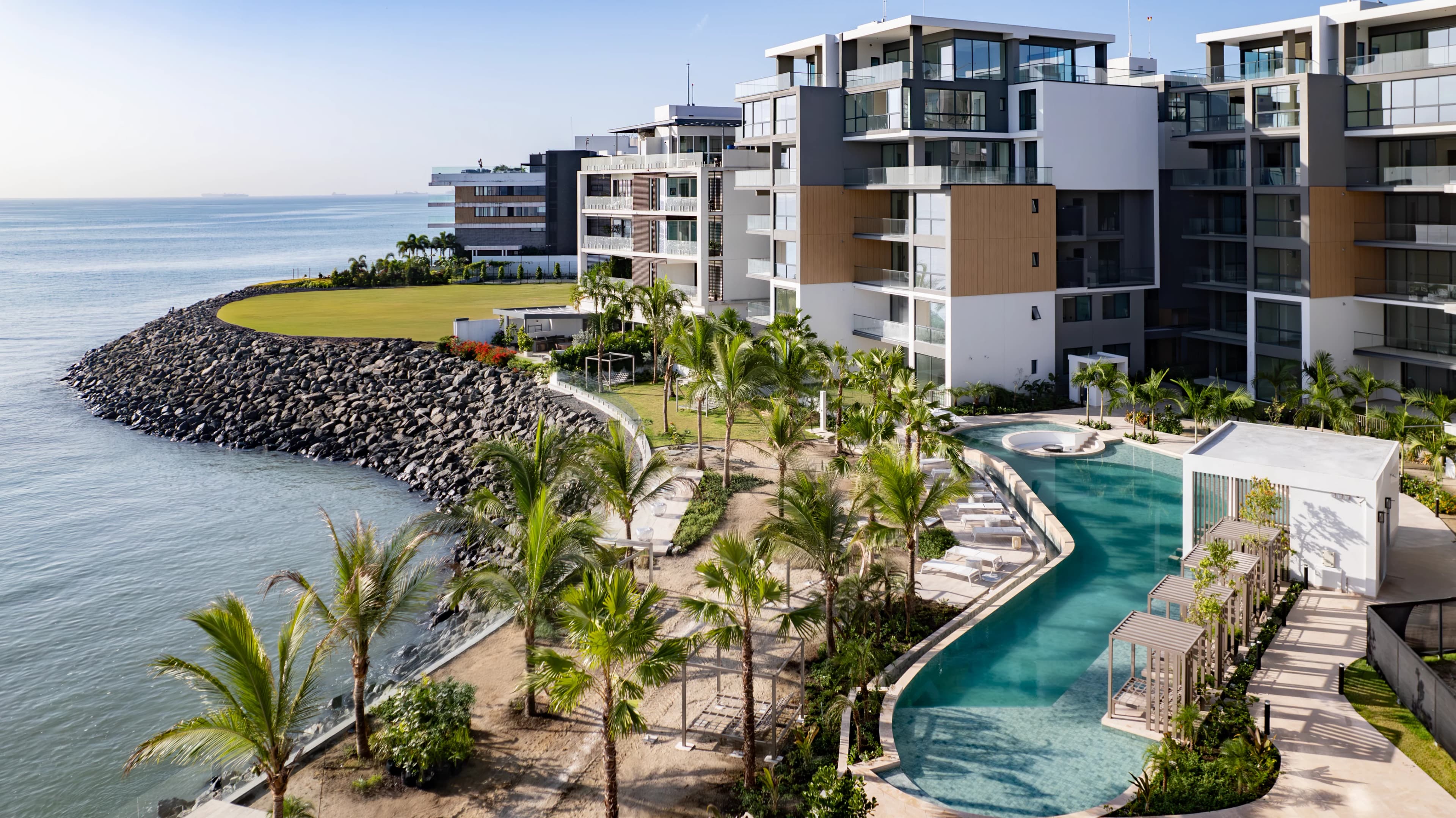 The Palms: buildings, landscaped grounds and the water’s edge.