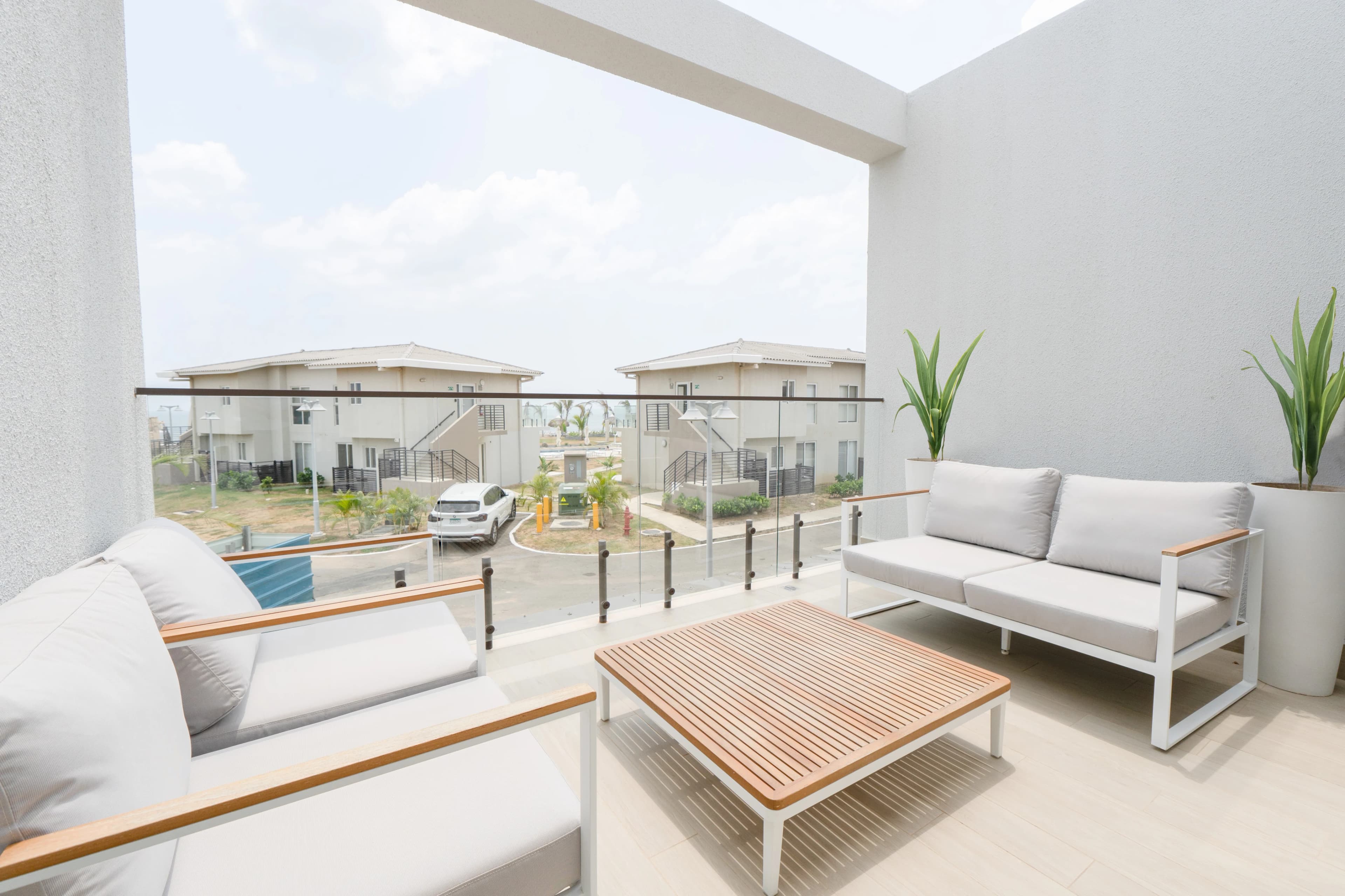The Tides: a furnished terrace looking across the collection.